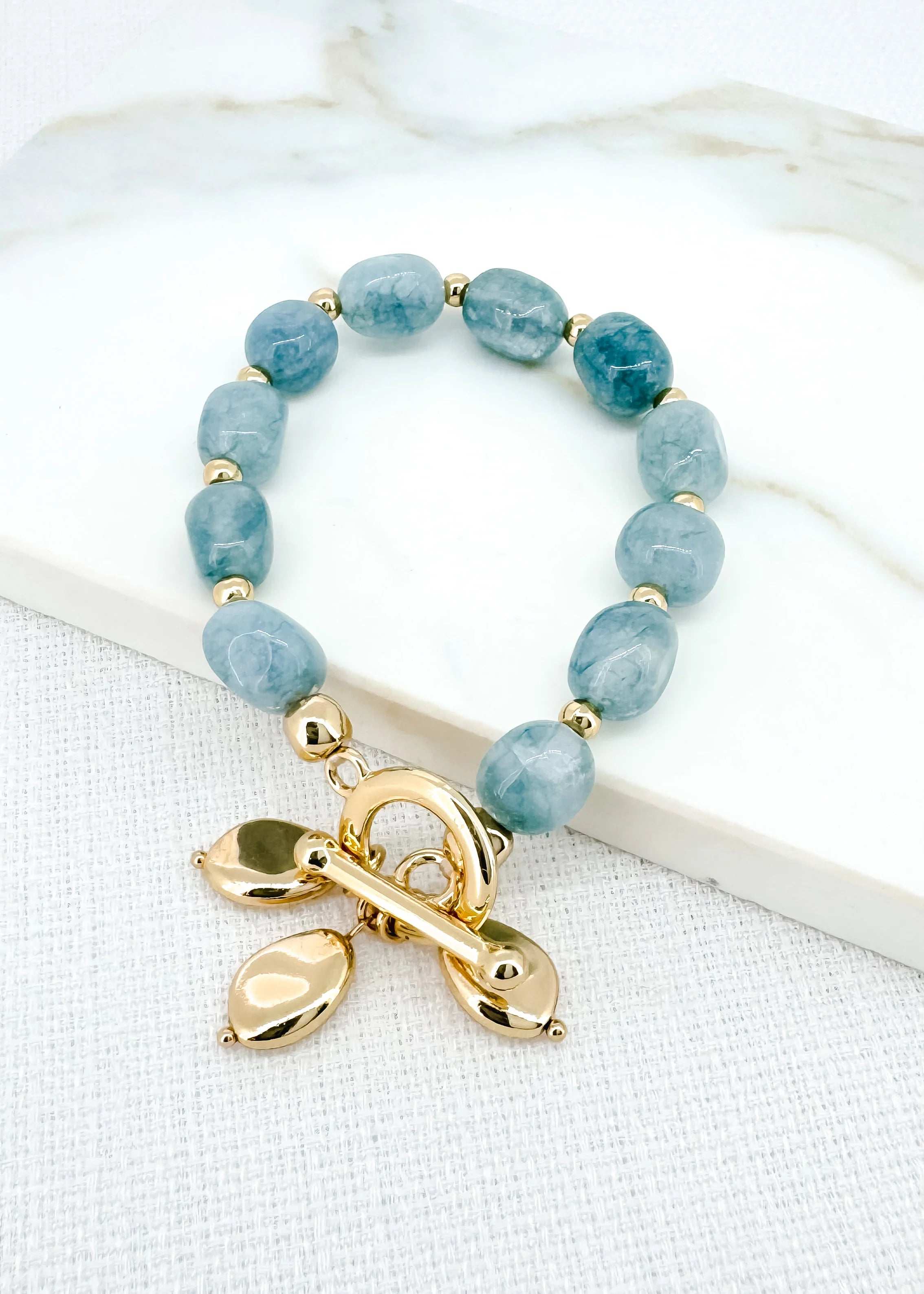 Gold & Blue Stone Stretch Bracelet with T-Bar & Charms