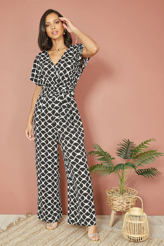 Yumi Black Geometric Print Wrap Jumpsuit - QHA UK