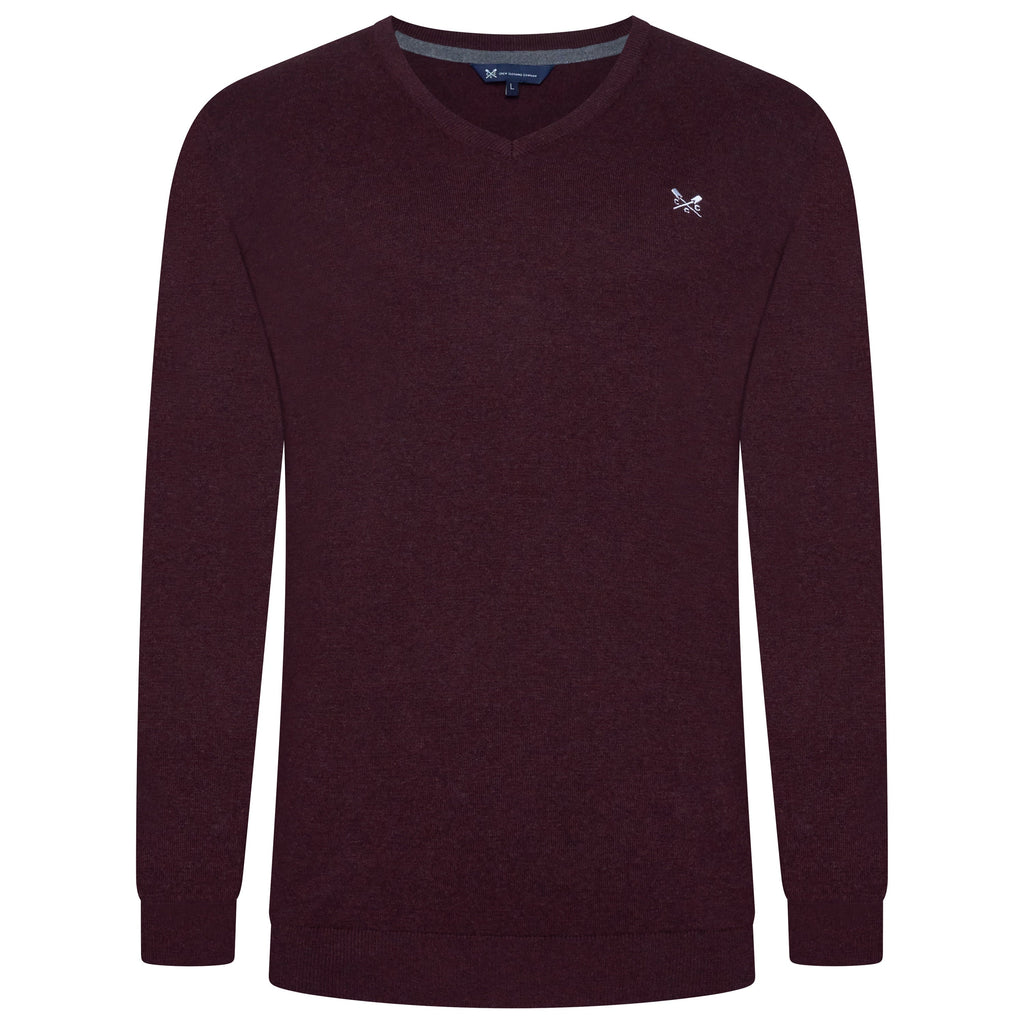 Maroon sweater with a small logo on a white background