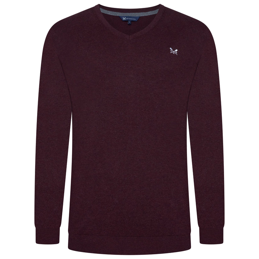 Maroon sweater with a small logo on a white background