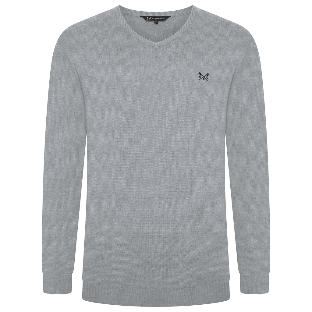 Gray sweater with a small logo on a white background