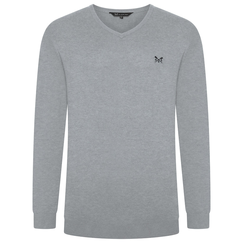 Gray sweater with a small logo on a white background