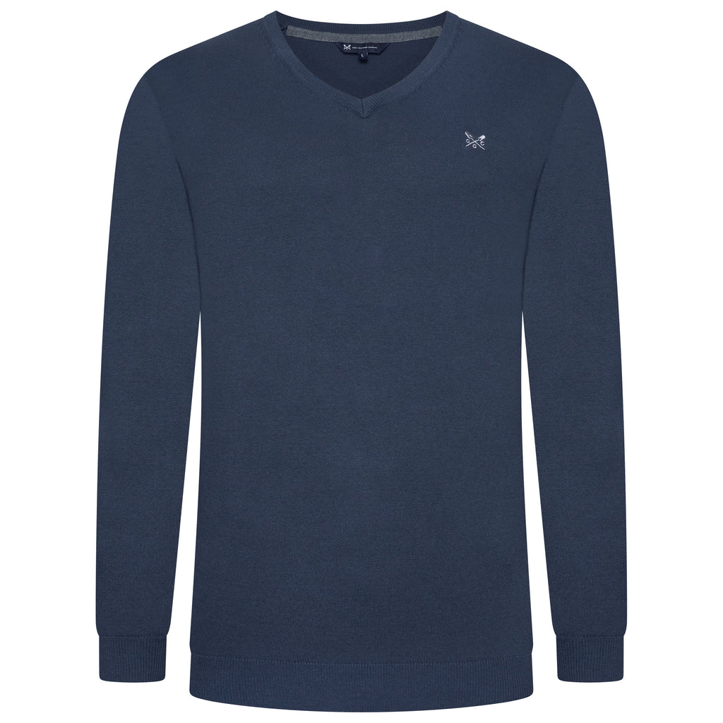 Navy blue long-sleeve shirt with a small logo on a white background
