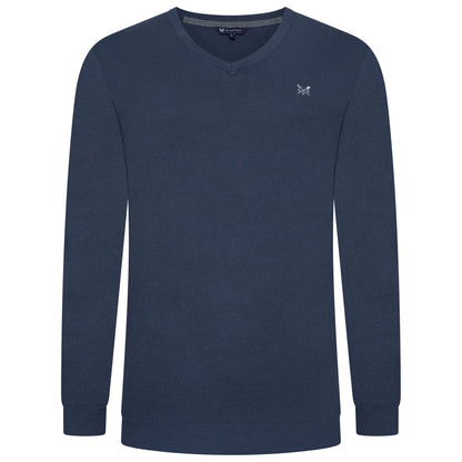 Navy blue long-sleeve shirt with a small logo on a white background