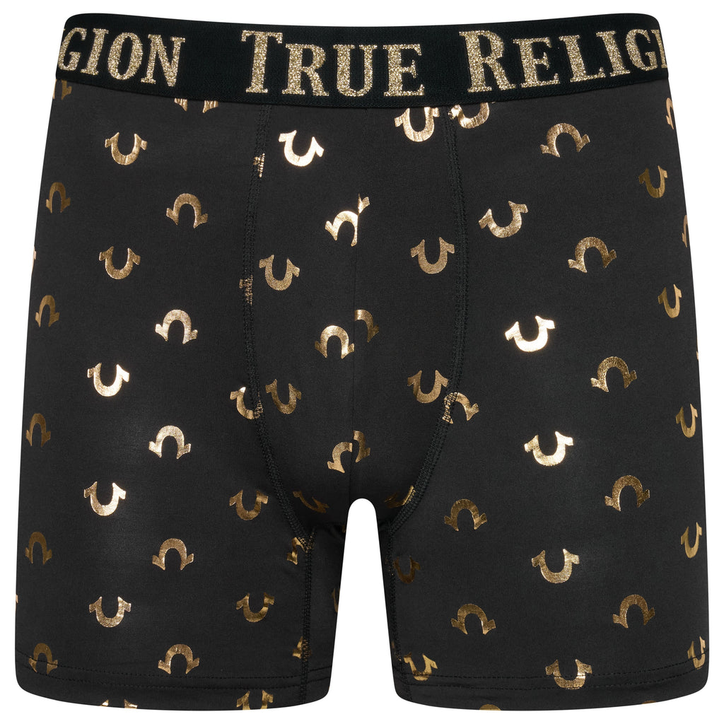 Black boxer briefs with gold horseshoe pattern and 'True Religion' waistband on a white background