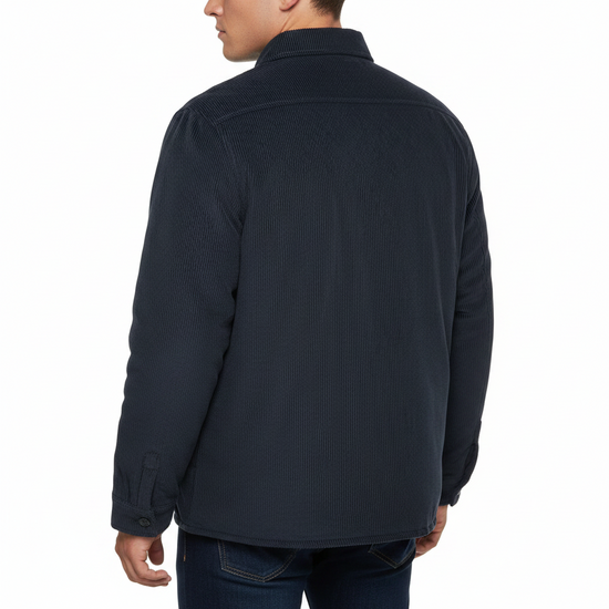 A man wearing a dark navy textured button-up shirt, shown from the back against a solid white background.