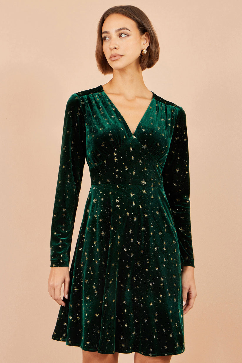 Yumi Velvet V-Neck Skater Dress with Foil Star in Green – Front View